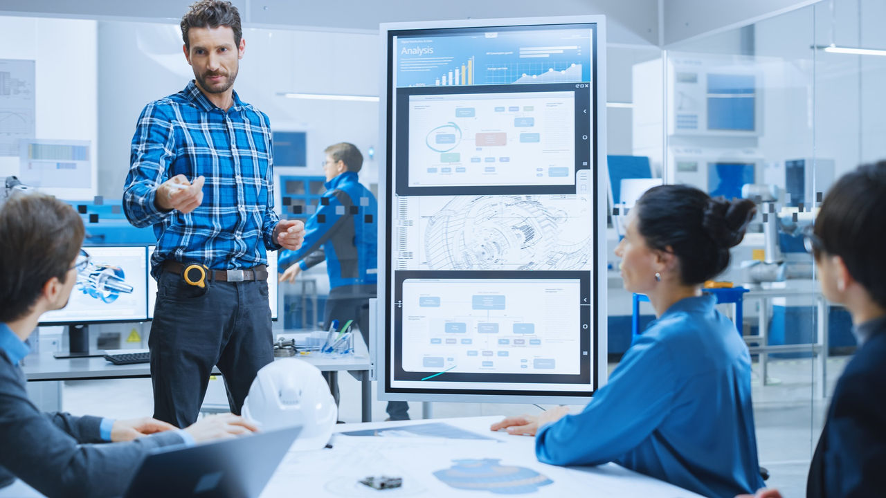 On a Meeting Chief Industrial Engineer Reports to a Group of Specialists, Managers, Uses Digital Whiteboard to Show Statistics and New Eco-Friendly Engine Concept. Sustainable Green Energy Research